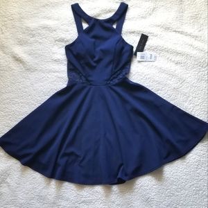 High neck royal blue cocktail dress with lace side panels